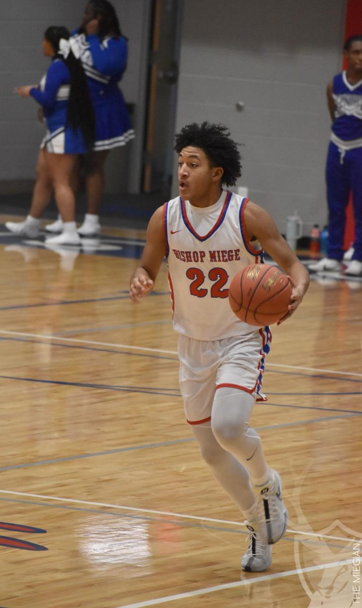 Dribbling the ball up the court, sophomore Jayden McDaniel looks ahead for his teammates. “We have a very strong team and we have really good connections with each other,” McDaniel said. “My favorite game so far this season was the game against Shawnee Mission North when we scored 100 points in triple overtime. If we can keep that up and lift each other up we will finish out the season strong.”