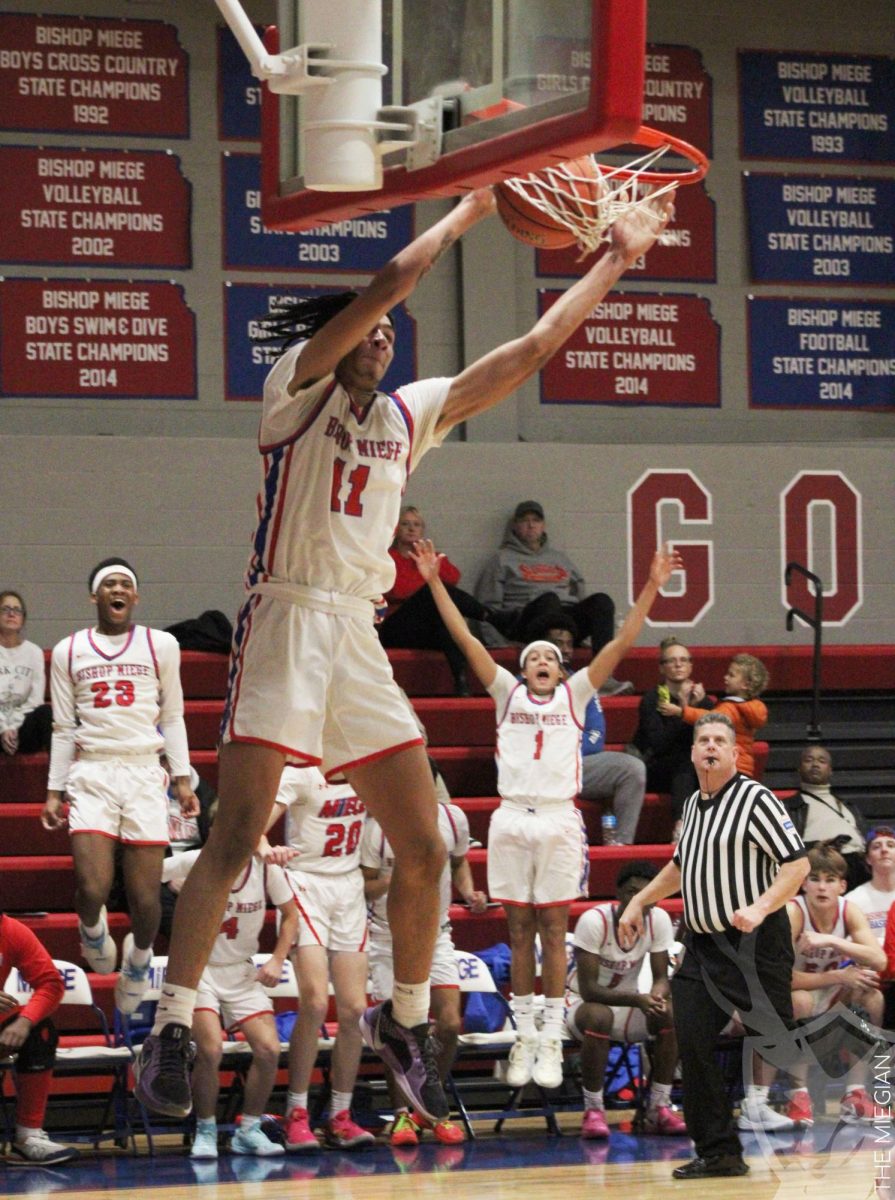 After getting a fast break, senior JJ Tucker gets his team hyped up during the game against Barstow on Dec. 5. “I was feeling very energetic. This possession got us a lot of momentum, and my teammates had a lot of energy as well,” Tucker said. “I am very sad to be leaving, but at the same time I am on a new beginning. There is a lot to look forward to, and I am excited to spend the rest of the season with my friends and family.” 