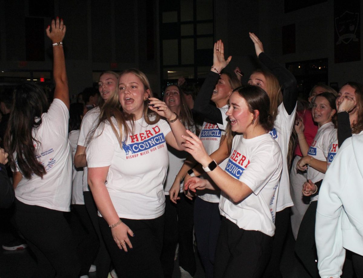 Leading by example, senior Parker Benz dances it up at the seventh and eighth-grade mixer. “It was nostalgic to look back and think about what I felt as a seventh grader,” Benz said. “I’m glad I can be in the position to lead them and make their path a little easier.”