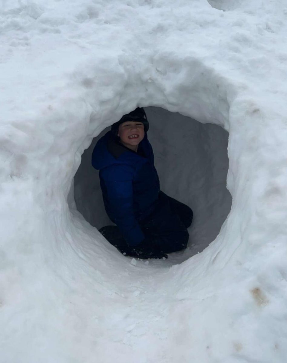 To pass time during the snow days, kids such as staffer Sophia Hart's brother play in the multiple inches of snowfall. The amount of snow has added to the conditions that first-responders face.