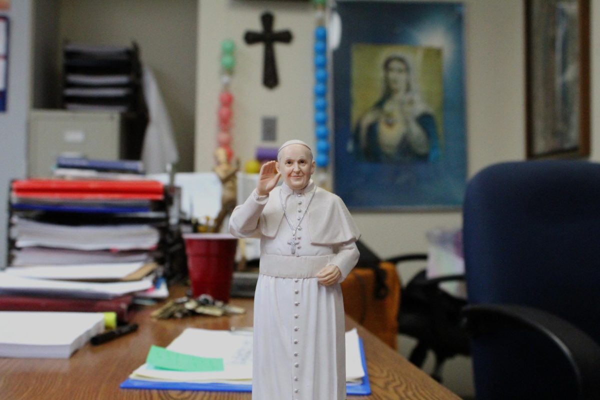 Theology teacher Steve Koesterer keeps a figure of Pope Francis perched on his desk to remember the passed Father.  