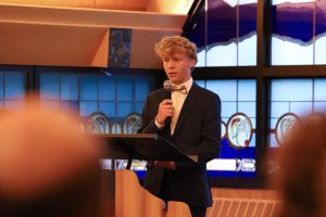 Power words. Senior Joseph Charles delivers his witness speech in the presence of classmates, faculty and Jesus. The first Summit Night of the year was held on Sept. 17 in the St. Angela Merici Chapel