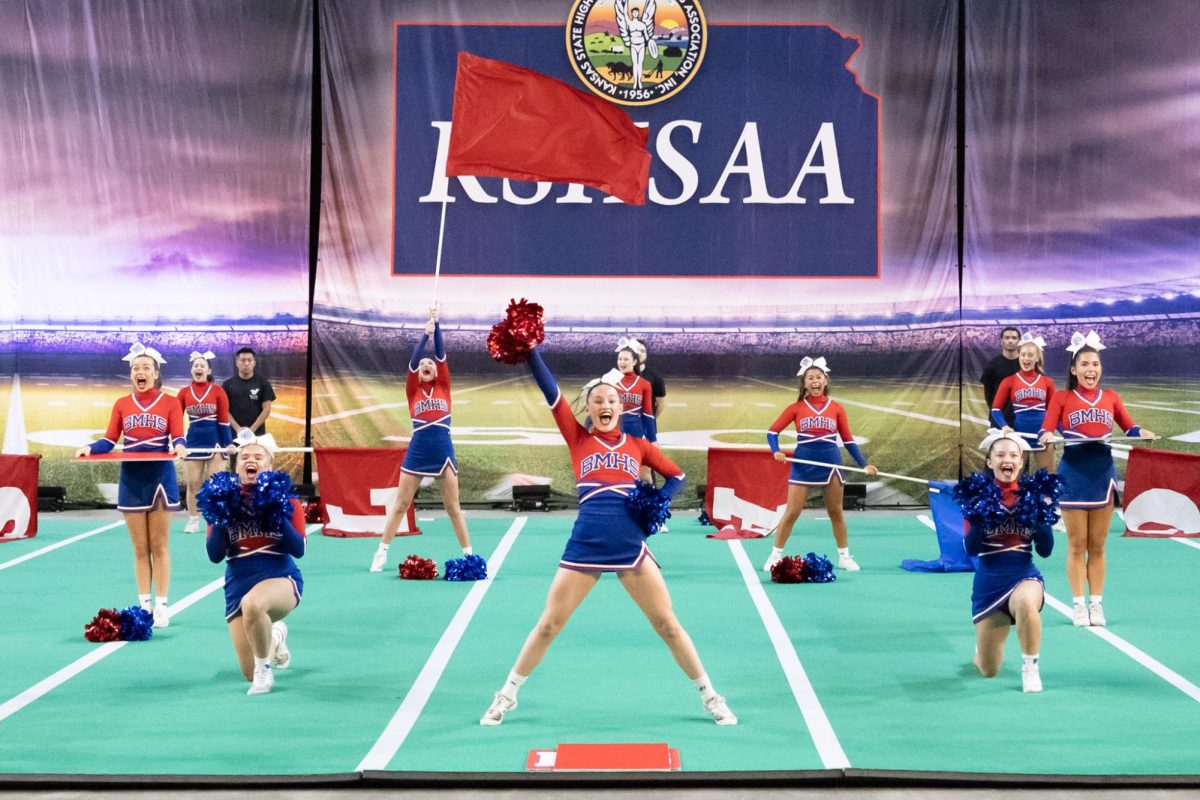 Strong bonds. Team captain Liza Martinez focuses on smiling and hitting her marks while performing one last time at the state competition. “What’s been different this year has definitely been just like the bond of the team overall, we are all a lot closer,” Martinez said. “I love getting to cheer with some of my best friends.” 
